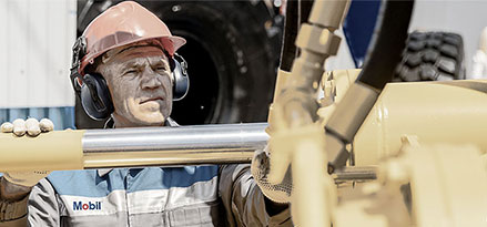 Mobil worker working with a large hydraulic