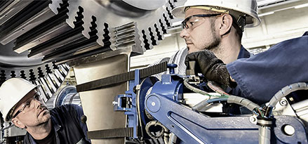 Mobil customer and worker under a gas turbine