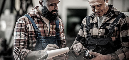 Mobil workers looking at a bearing